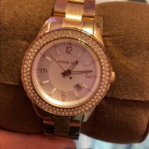MK rose gold watch.